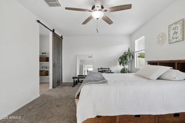 a bathroom with a double vanity sink mirror and shower