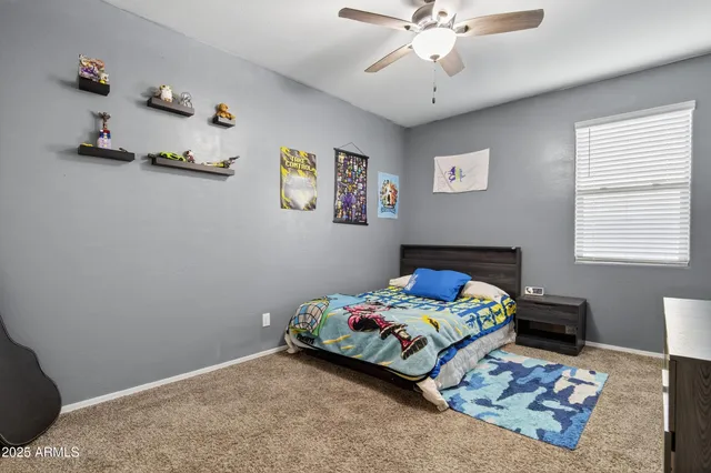 a bedroom with a bed and a cabinet