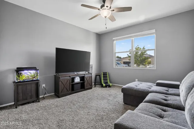 a living room with furniture and a window