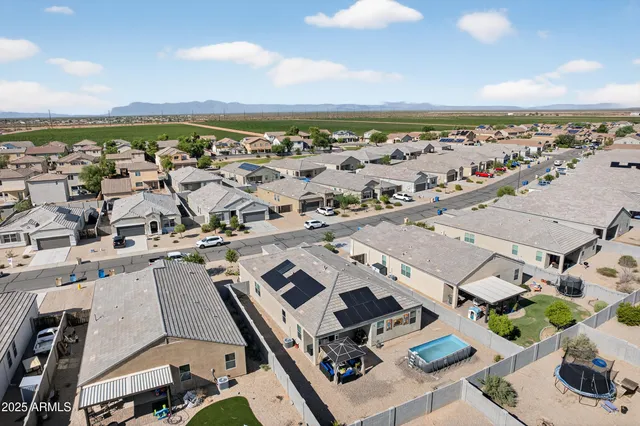 an aerial view of a chairs and table