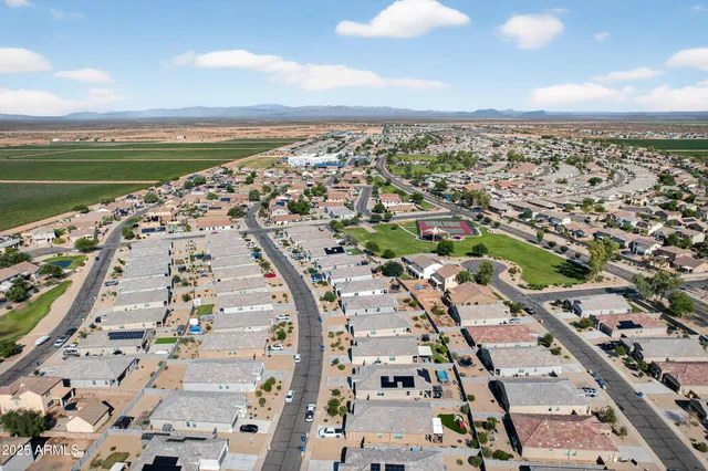 an aerial view of residential house with outdoor space and pool
