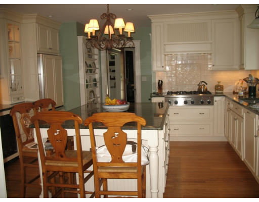 371 Weston Road Wellesley, MA 02481 - Photo 3 of 12 a kitchen that has a dining table and chairs