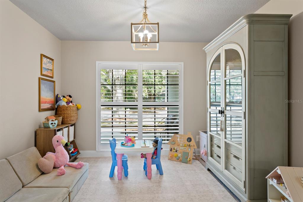 6712 Jennifer Drive Temple Terrace, FL 33617 - Photo 15 of 30 a view of a livingroom with furniture window and outside view