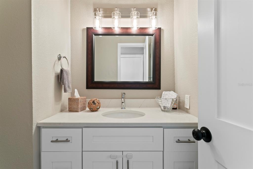 6712 Jennifer Drive Temple Terrace, FL 33617 - Photo 16 of 30 a bathroom with a sink vanity and mirror