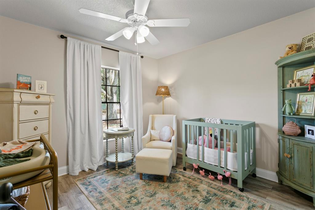 6712 Jennifer Drive Temple Terrace, FL 33617 - Photo 22 of 30 a bedroom with furniture and a window