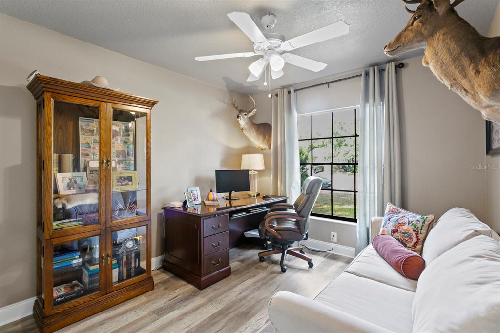 6712 Jennifer Drive Temple Terrace, FL 33617 - Photo 24 of 30 a view of a livingroom with workspace and a window