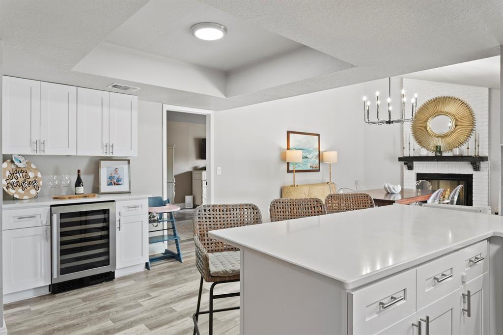 6712 Jennifer Drive Temple Terrace, FL 33617 - Photo 3 of 30 a kitchen with a table chairs a stove and wooden floor