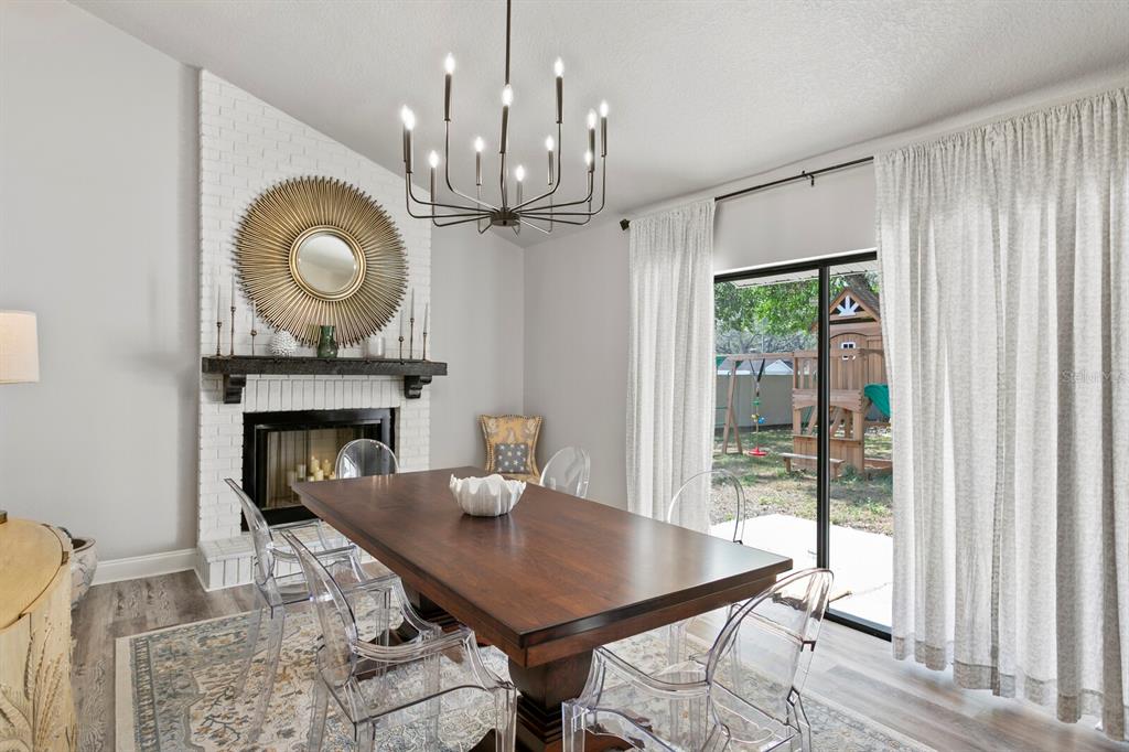 6712 Jennifer Drive Temple Terrace, FL 33617 - Photo 5 of 30 a view of a dining room with furniture window and wooden floor