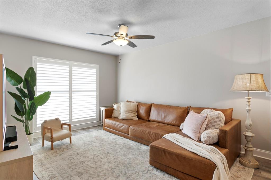 6712 Jennifer Drive Temple Terrace, FL 33617 - Photo 6 of 30 a living room with furniture and a window