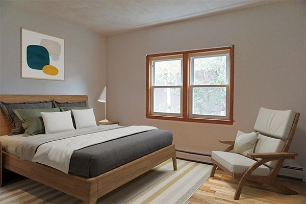 150 Brown Street, Unit 1L Waltham, MA 02453 - Photo 4 of 11 a bedroom with a bed and a window