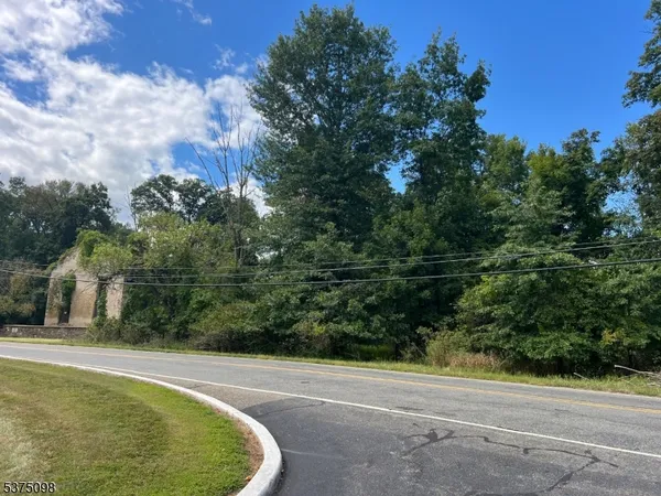 a view of a swimming pool with a yard