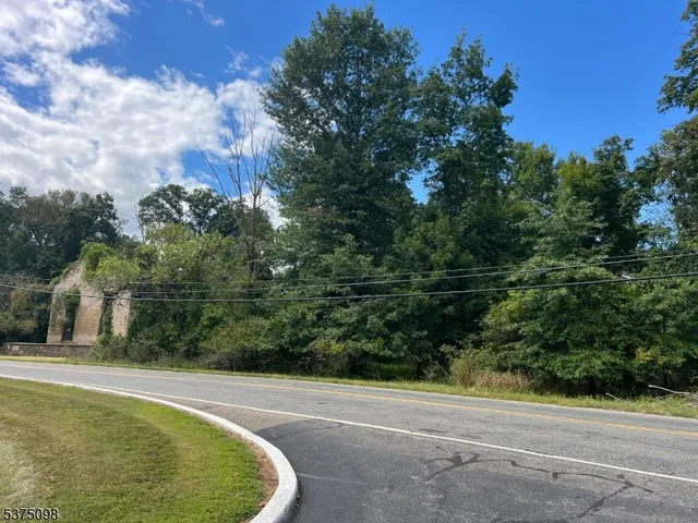 a view of a swimming pool with a yard