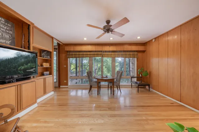 a view of a dining room with furniture window and outside view