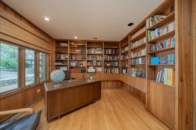 a room with furniture and book shelf