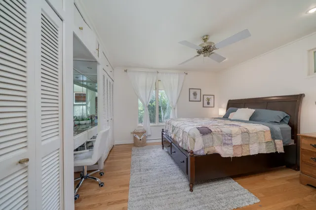 a bedroom with a bed and a table in it