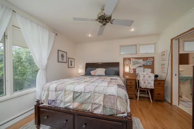 a bathroom with a sink toilet and a mirror