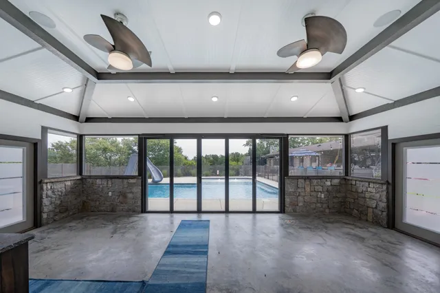 a view of outdoor space with wooden floor and iron stairs