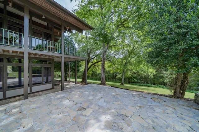 a view of a swimming pool with a patio