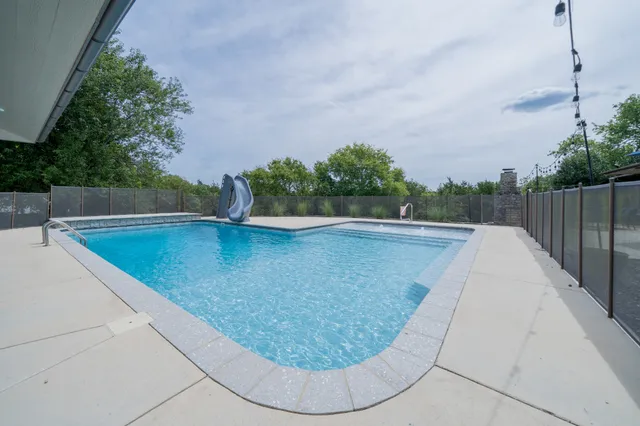 a view of a backyard with a trees