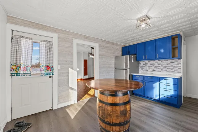a kitchen with stainless steel appliances granite countertop a stove and a refrigerator
