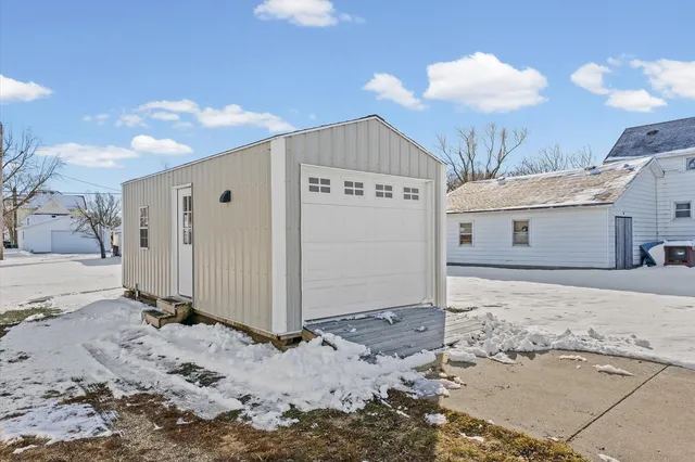 a view of a house with a snow in the yard
