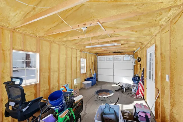 a bedroom with furniture and a window