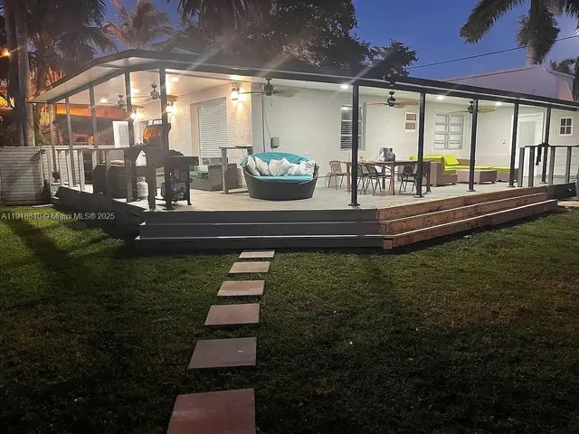 a view of swimming pool with outdoor seating