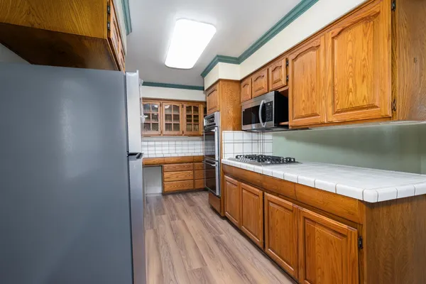 a kitchen with a stove and a microwave
