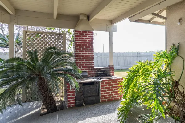 a view of swimming pool with outdoor seating and yard in back