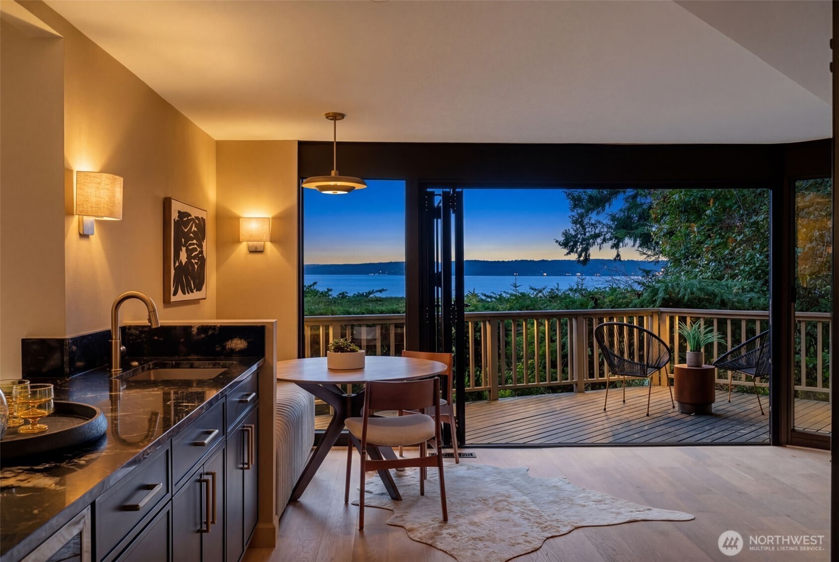 2650 Southwest 151st Place Burien, WA 98166 - Photo 14 of 40 a kitchen with a table chairs and a barbeque