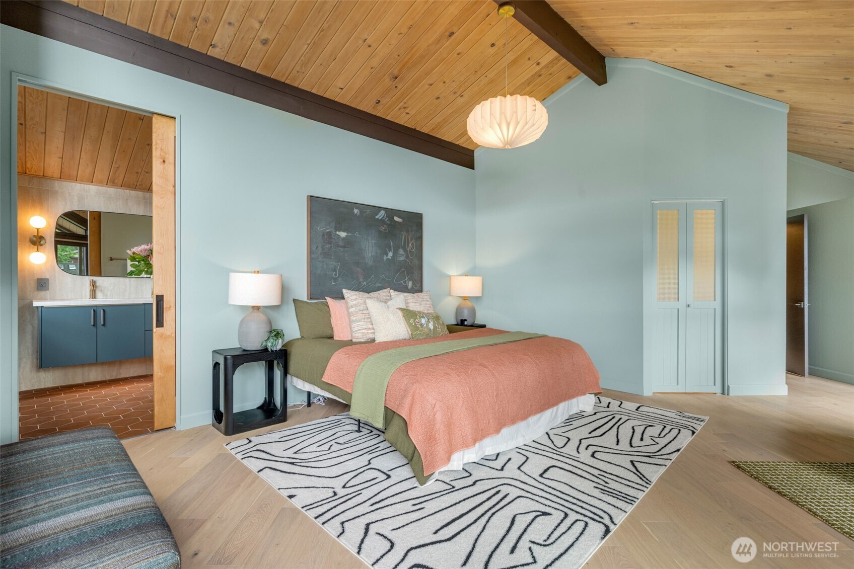 2650 Southwest 151st Place Burien, WA 98166 - Photo 22 of 40 a bedroom with a bed and a chandelier