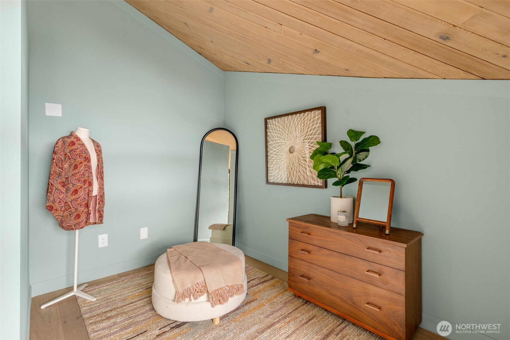 2650 Southwest 151st Place Burien, WA 98166 - Photo 23 of 40 a room with painting on the wall and a potted plant