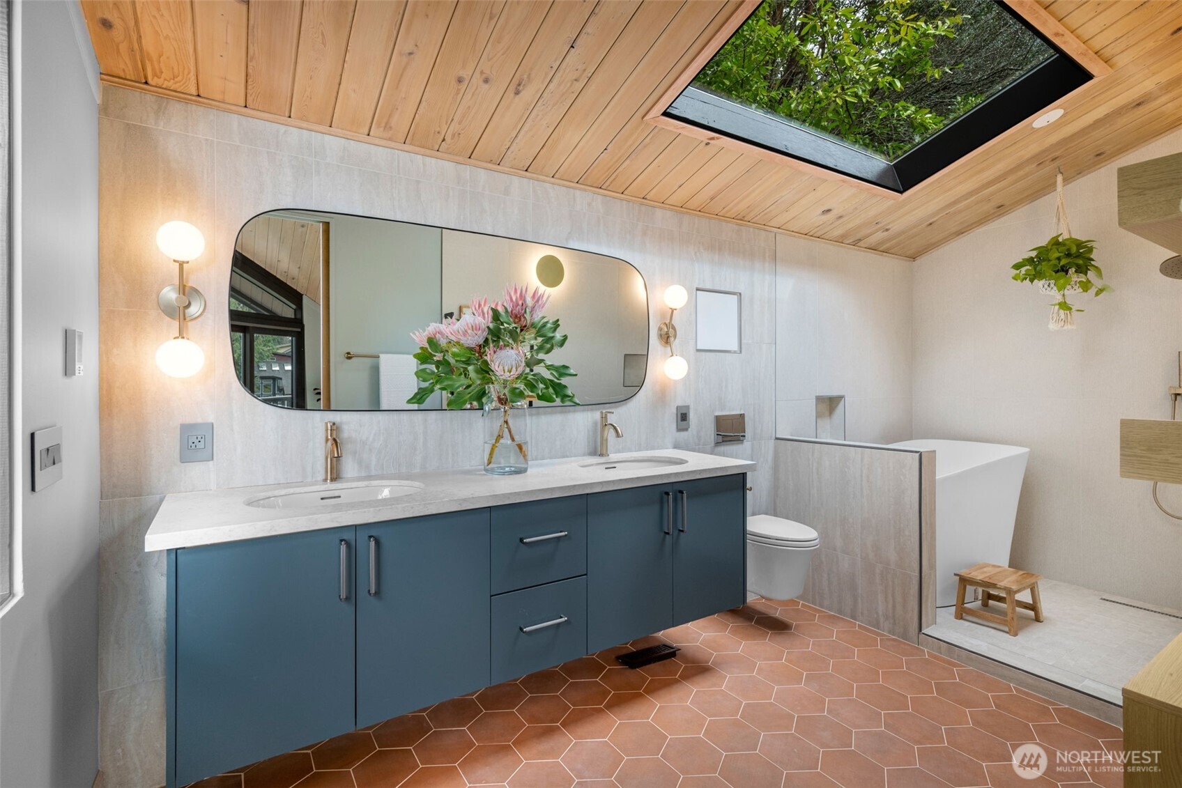 2650 Southwest 151st Place Burien, WA 98166 - Photo 24 of 40 a bathroom with a double vanity sink and a mirror