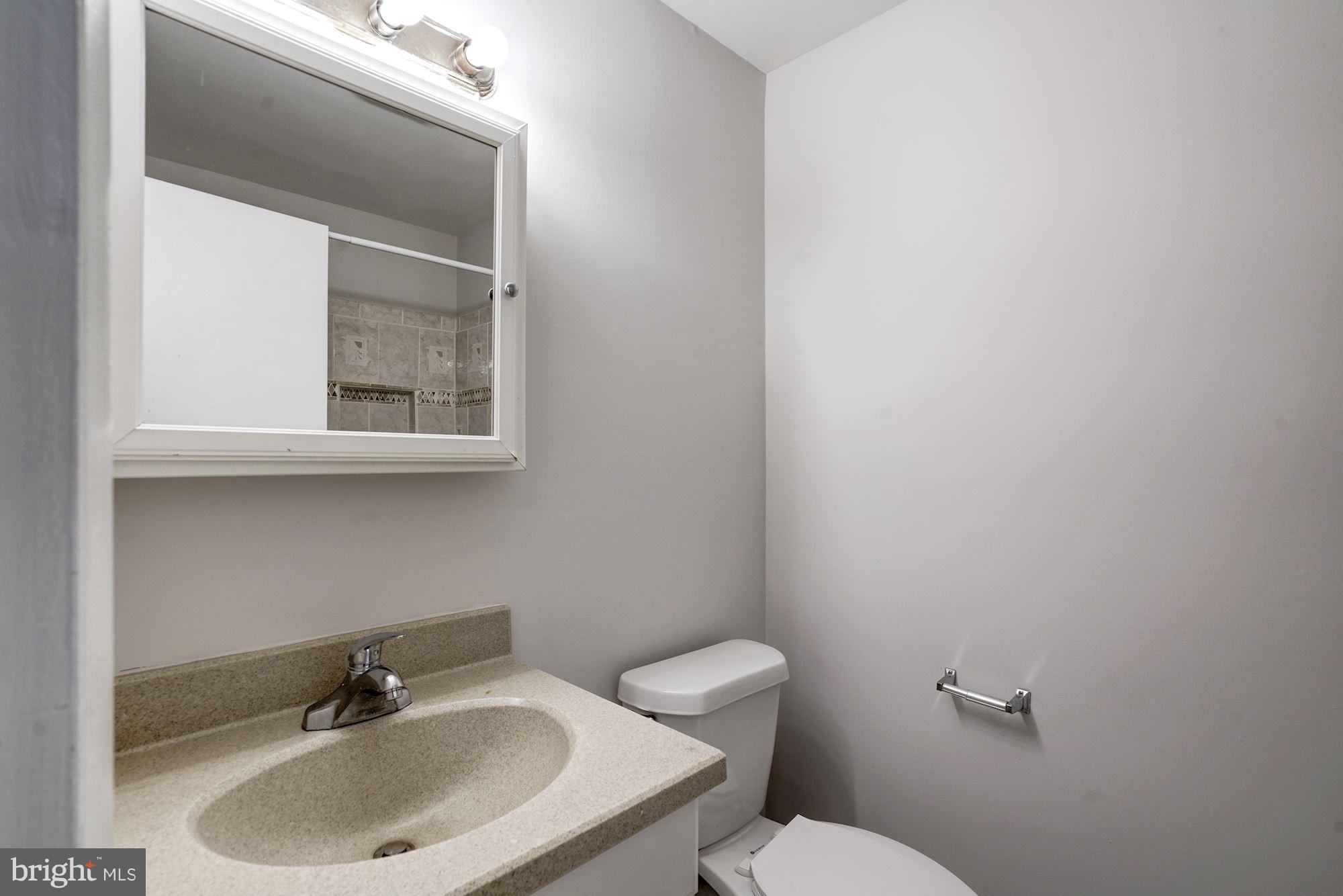 11049 Saffold Way Reston, VA 20190 - Photo 20 of 30 Hall Bath with New Light Fixture