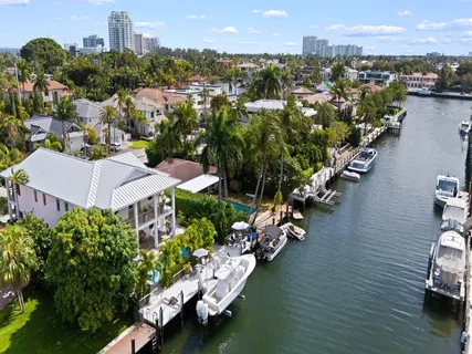 an aerial view of residential building and lake