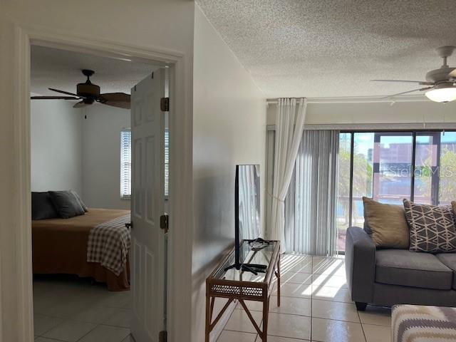 23465 Harbor View Road, Unit 1006 Punta Gorda, FL 33980 - Photo 17 of 41 a living room with furniture and a large window