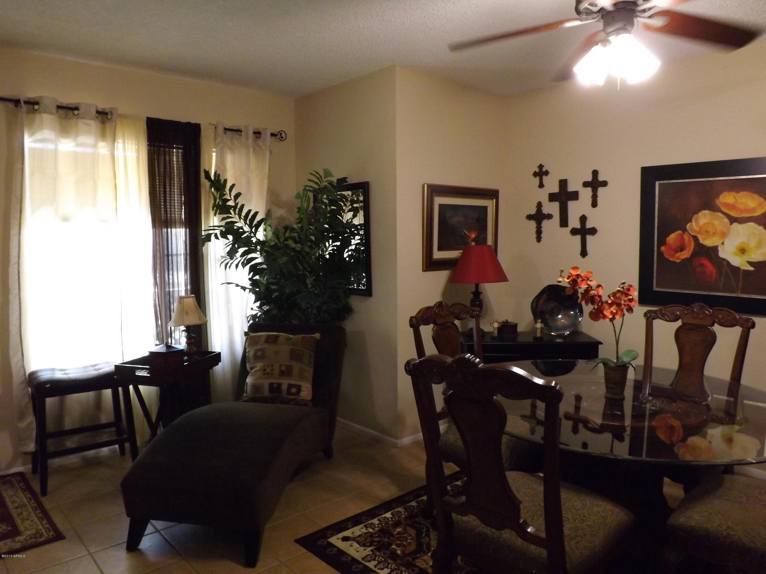 240 Old Litchfield Road, Unit 207 Litchfield Park, AZ 85340 - Photo 5 of 9 a living room with furniture dining room and wooden floor