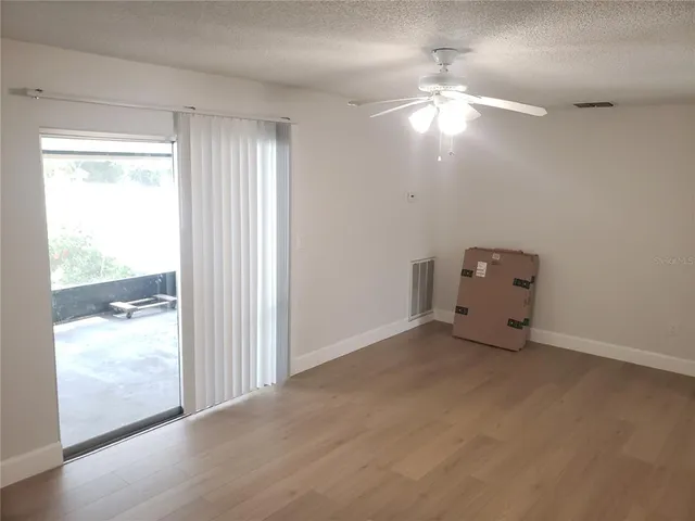 a view of a wooden deck with lake view