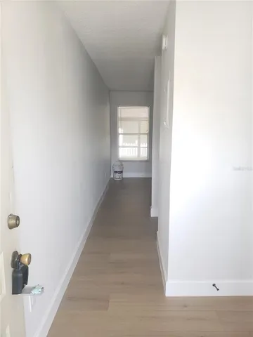 a kitchen with a microwave a stove and a refrigerator