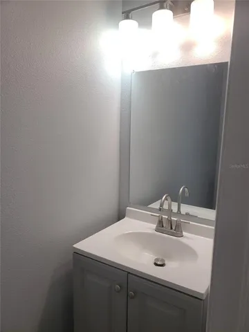 a room with sink and window