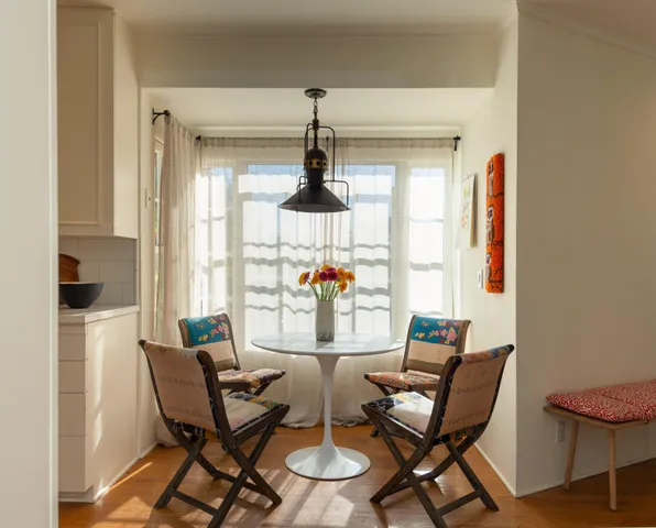 a view of a dining room with furniture window and outside view