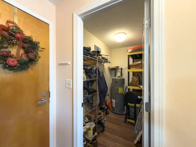 a utility room with cabinets dryer and washer