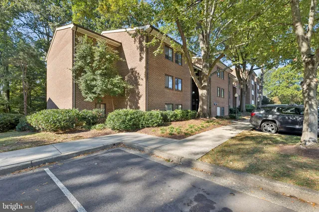 a view of a street with a building in the background