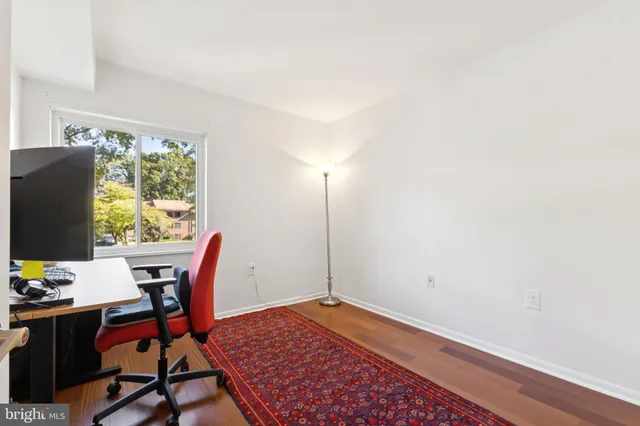 a workspace with furniture and window