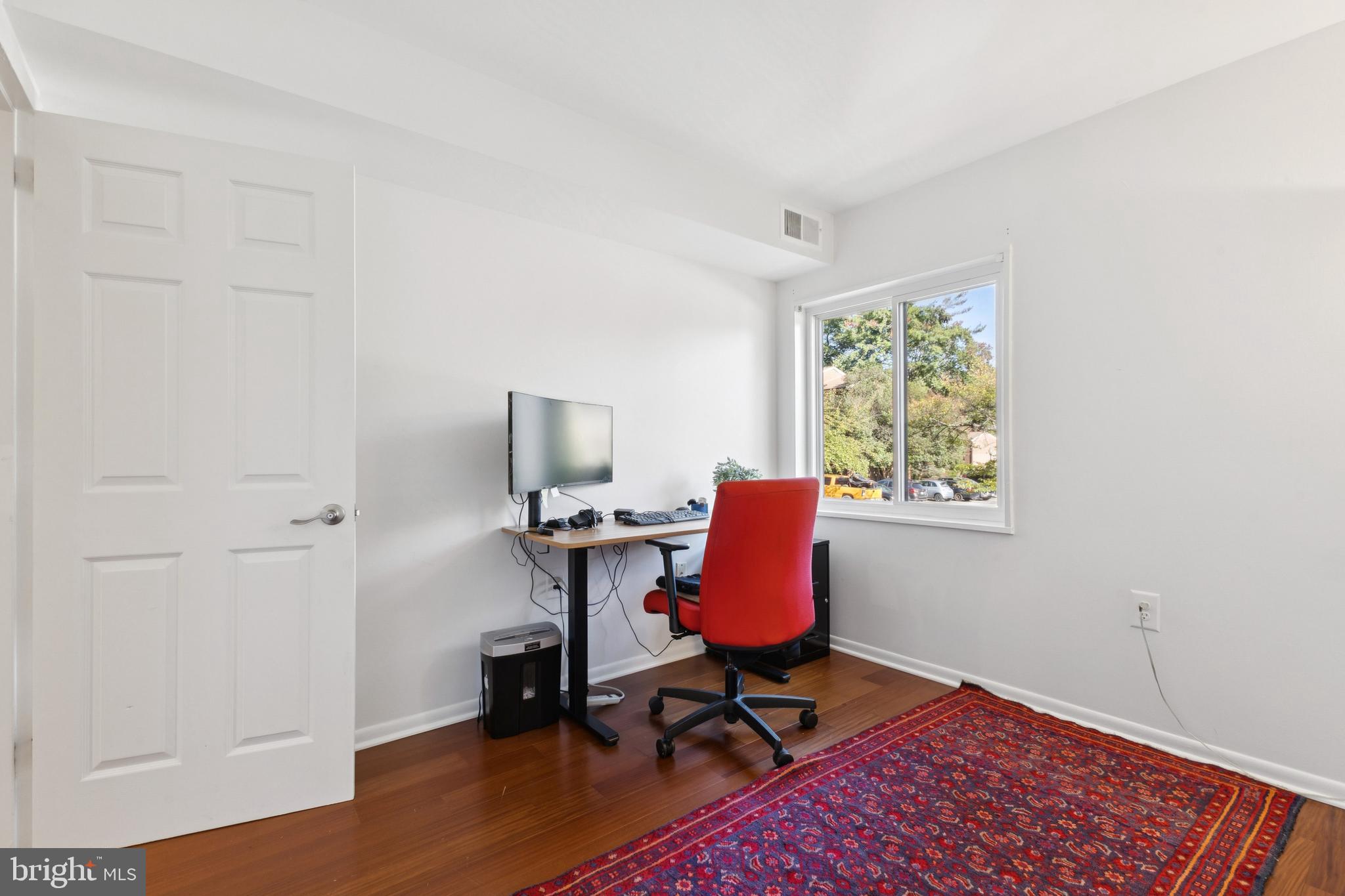 1413 Northgate Square, Unit 13/12B Reston, VA 20190 - Photo 21 of 25 a view of a workspace with furniture and a window