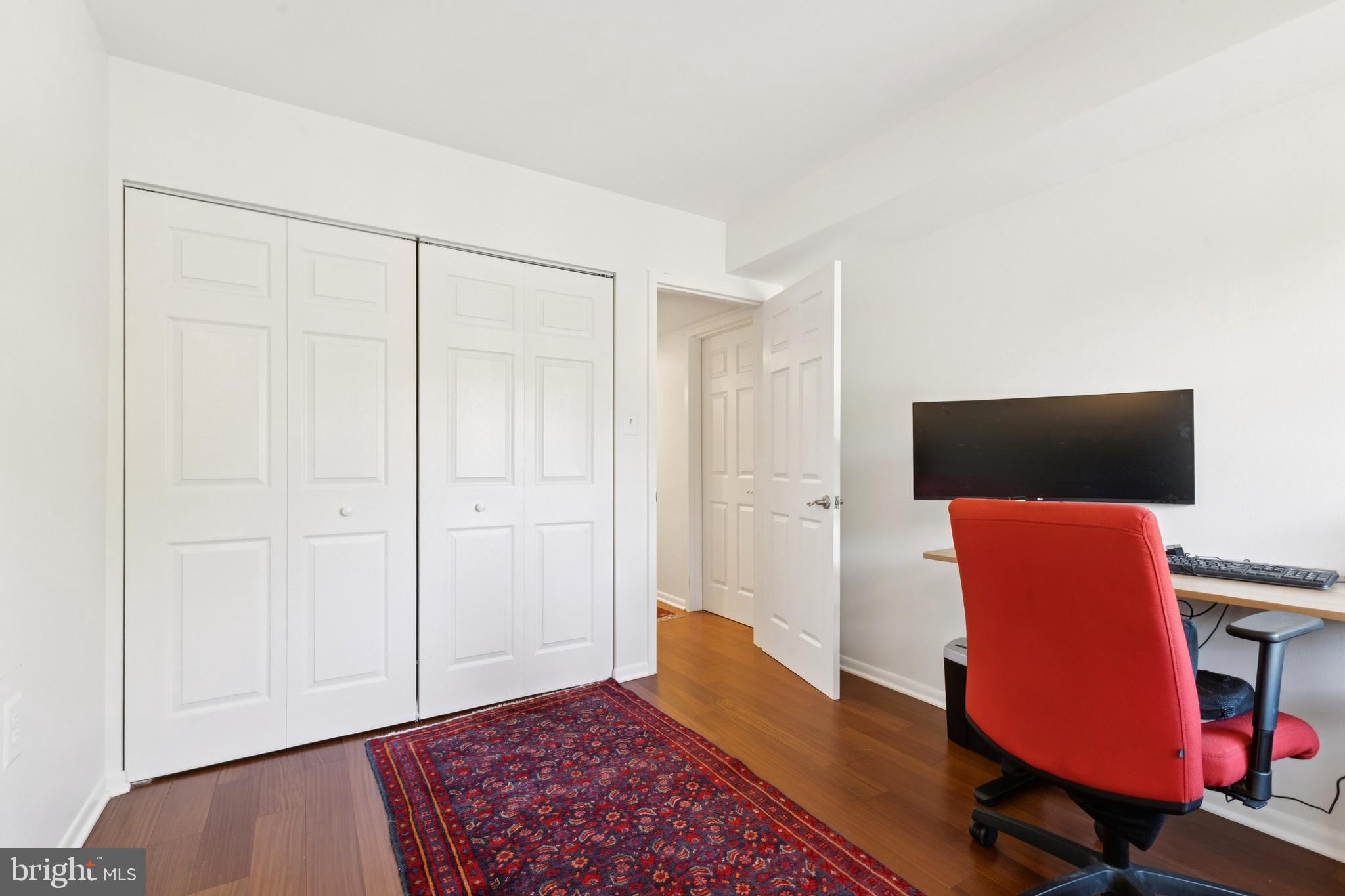 1413 Northgate Square, Unit 13/12B Reston, VA 20190 - Photo 22 of 25 a workspace with furniture and wooden floor