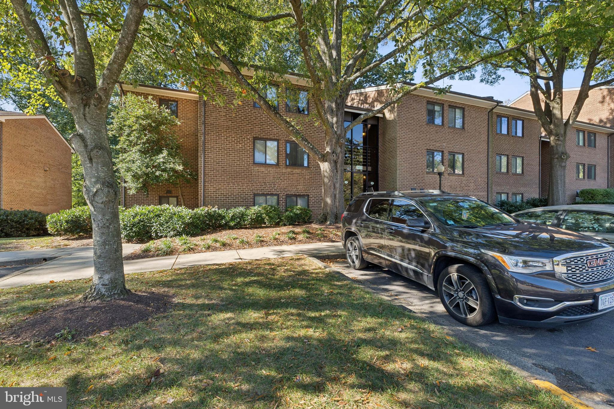 1413 Northgate Square, Unit 13/12B Reston, VA 20190 - Photo 24 of 25 a car parked in front of a house