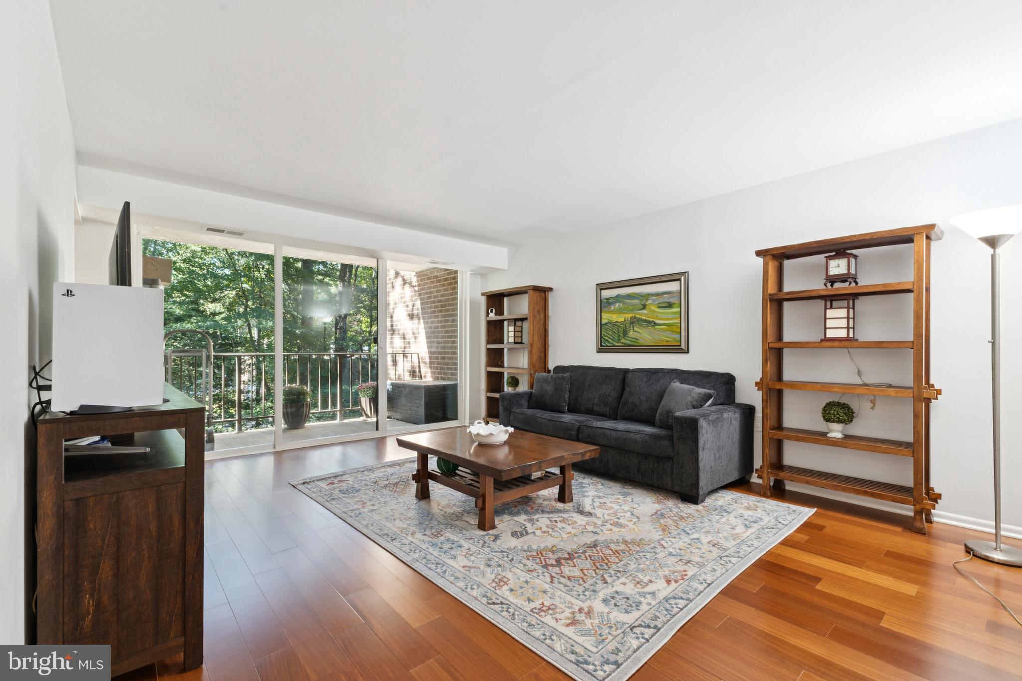 1413 Northgate Square, Unit 13/12B Reston, VA 20190 - Photo 3 of 25 a living room with furniture and a window