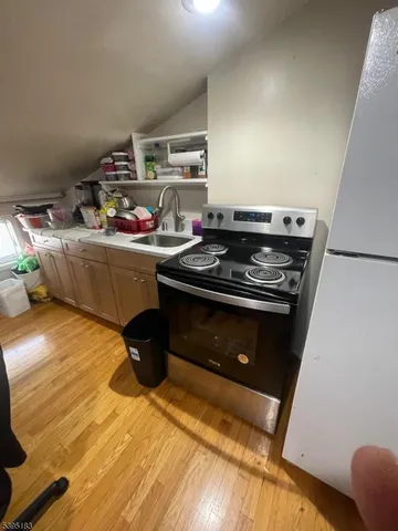 a kitchen with a stove and a refrigerator