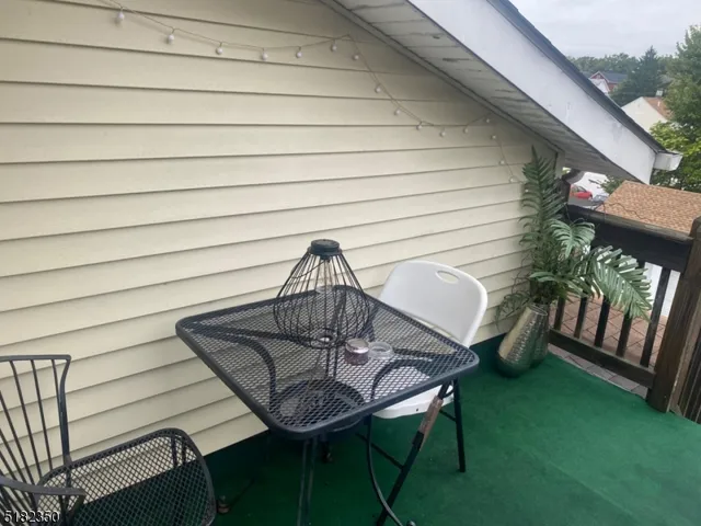 a view of a chairs and table in patio